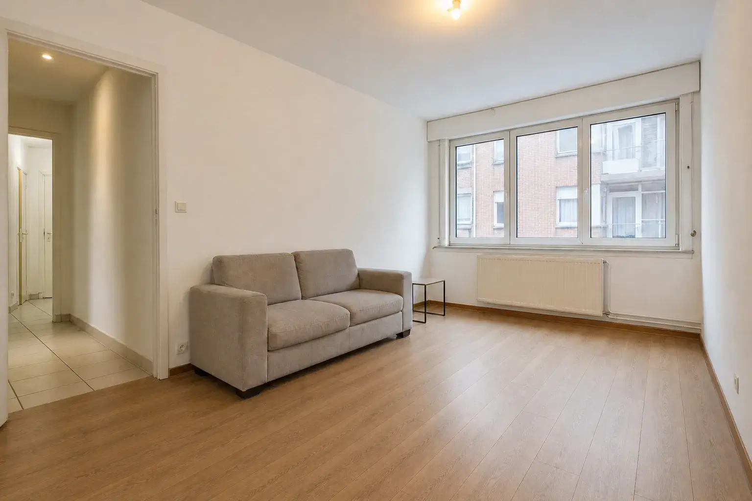 The same room with an even, finished wooden floor