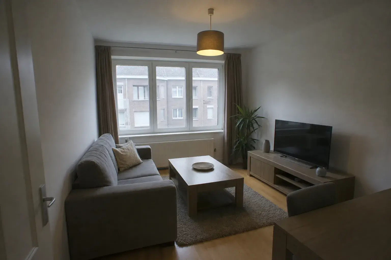 Dim living room with sofa and television