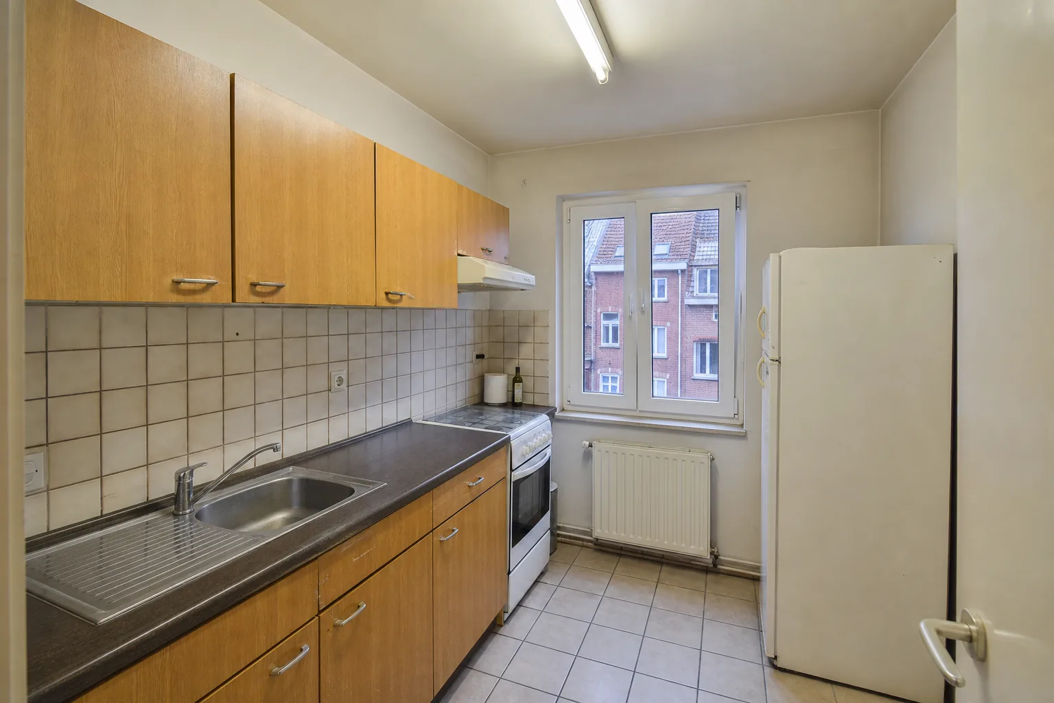 Dated but functional kitchen in a Belgian apartment